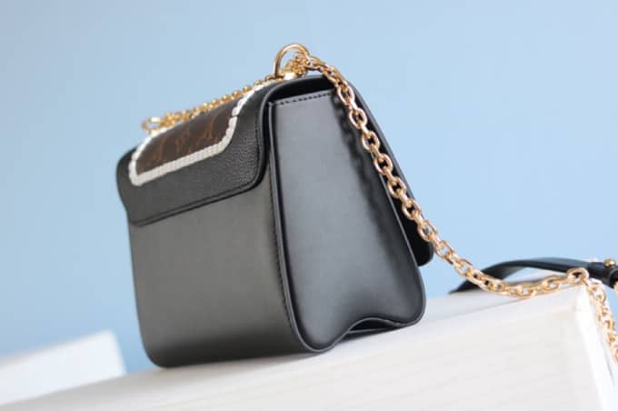 L0vis Vvtt0n Textured Epi Leather Twist Series Bag