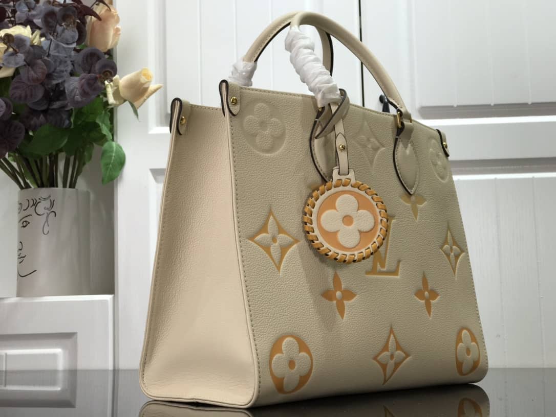 L0vis Vvtt0n On the Go MM Monogram Empreinte Two-way Tote Replica Apricot M45717