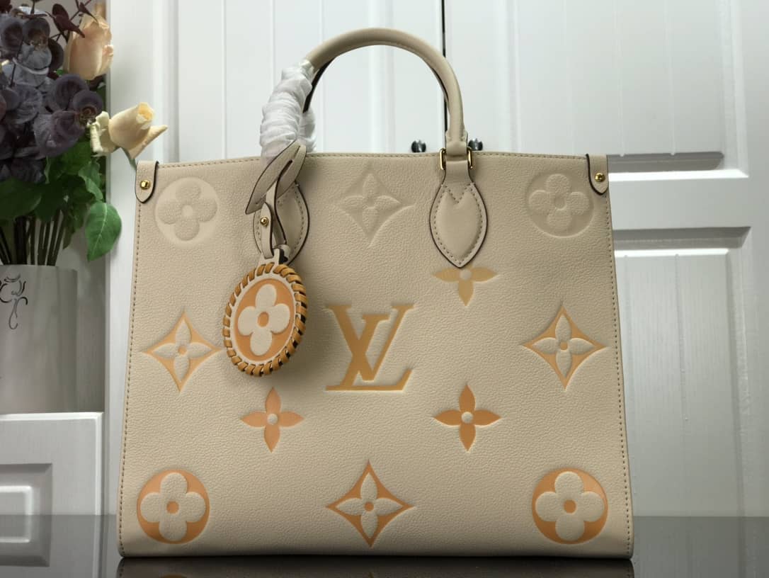L0vis Vvtt0n On the Go MM Monogram Empreinte Two-way Tote Replica Apricot M45717
